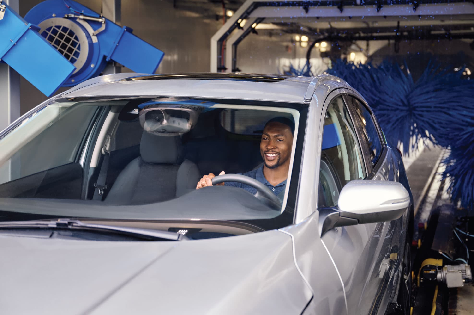 Man in the car during a car wash