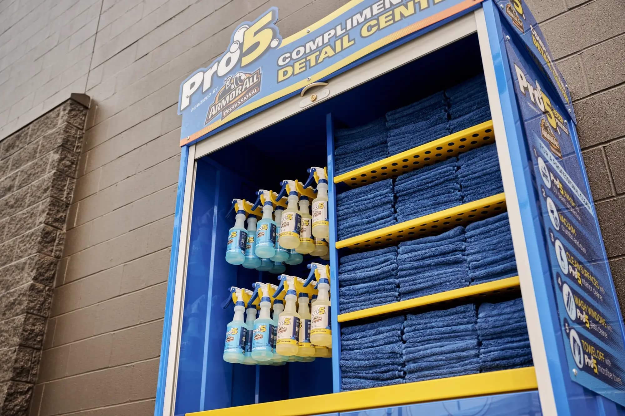 Detail center with cleaning products and blue towels